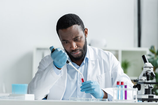 Illustration of a scientist using an electronic pipette