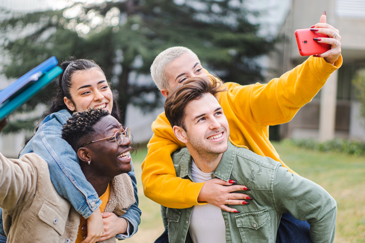 Group of college students snapping a selfie. 