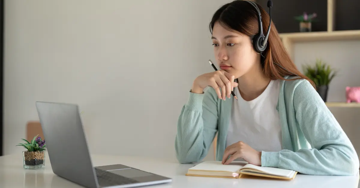 Woman noting important tax facts for filing form 1040-X.