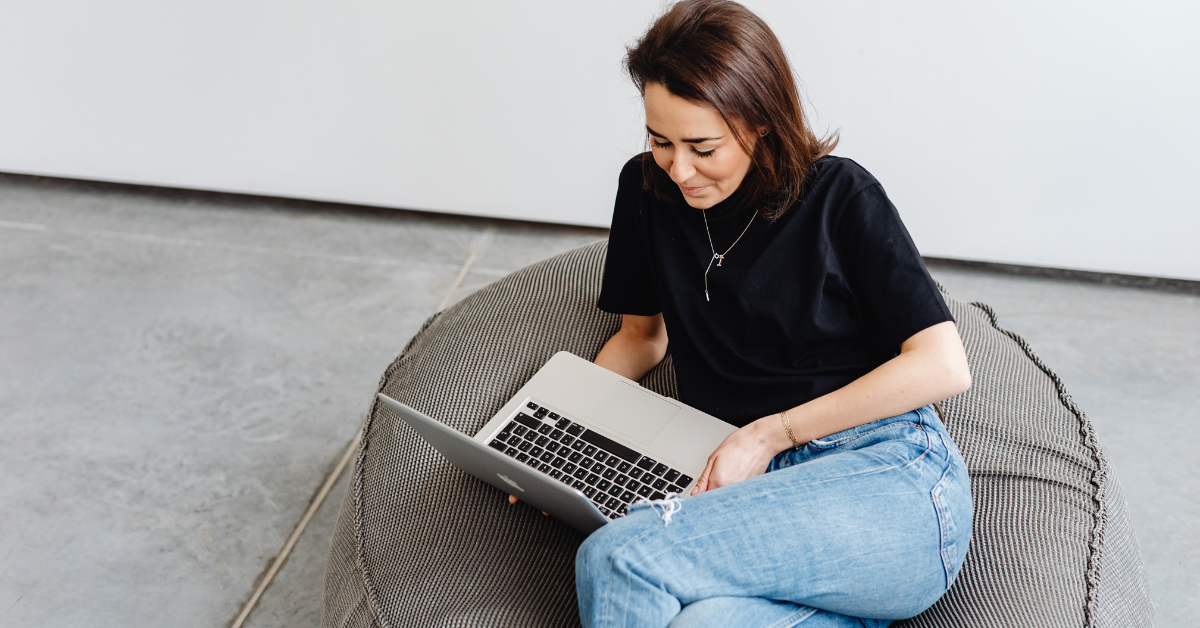 Woman monitoring the success of her OnlyFans subscription price and adjusting based on audience engagement and growth.