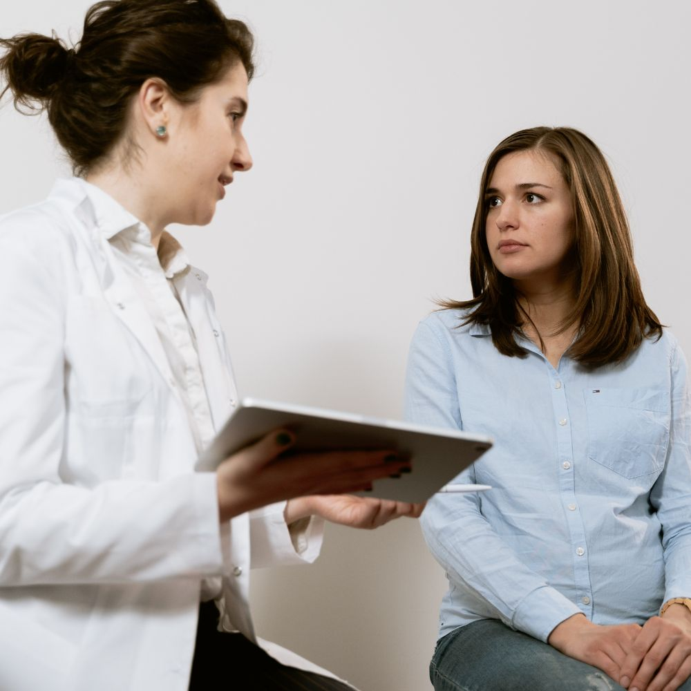 A person consulting with a healthcare professional