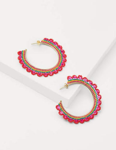 Colorful earrings can bring the party to a simple, solid color dress.