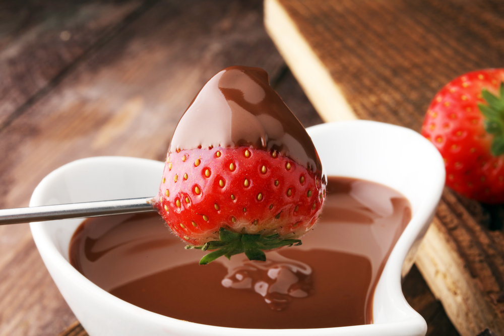 Chocolate Fondue Melted with Fresh Strawberries and Dark Chocolate 
