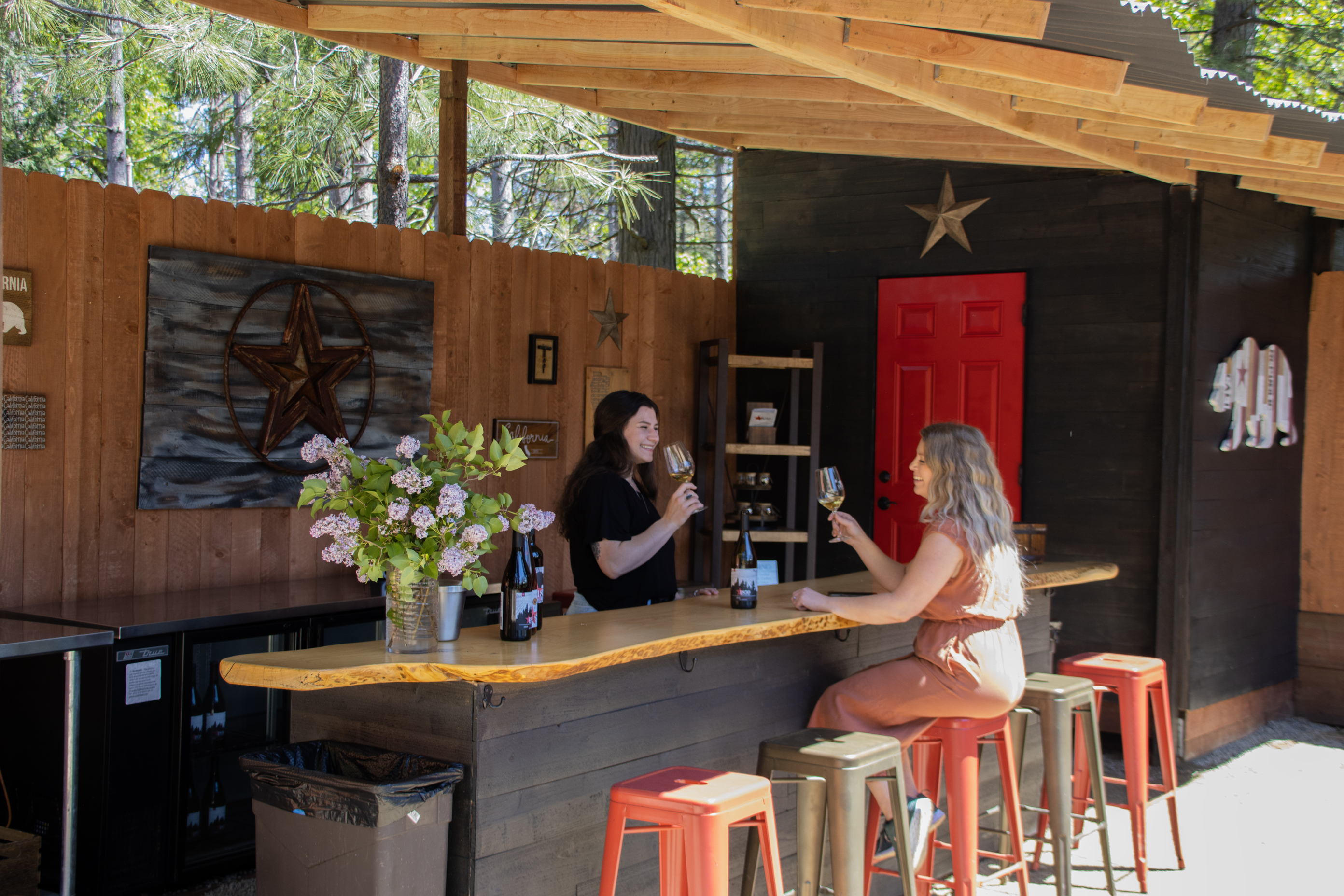 two women wine tasting at an El Dorado winery