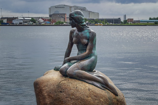 Mermaid sitting on the rock. top 20 happiest travel destinations in the world
