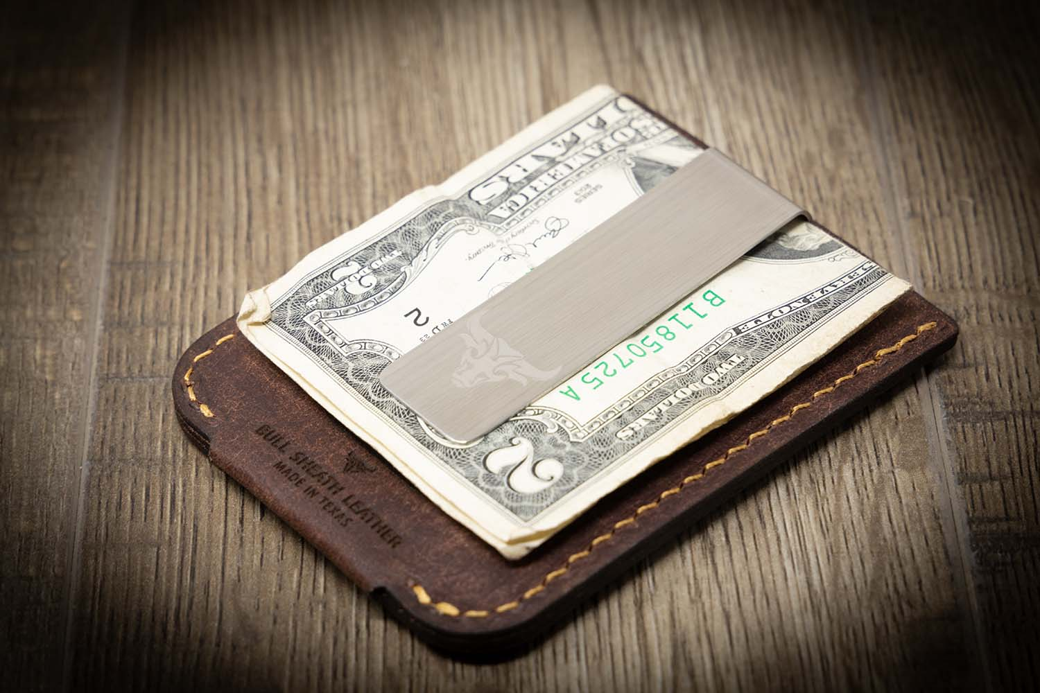 A wallet with a money clip and up to four characters of customization