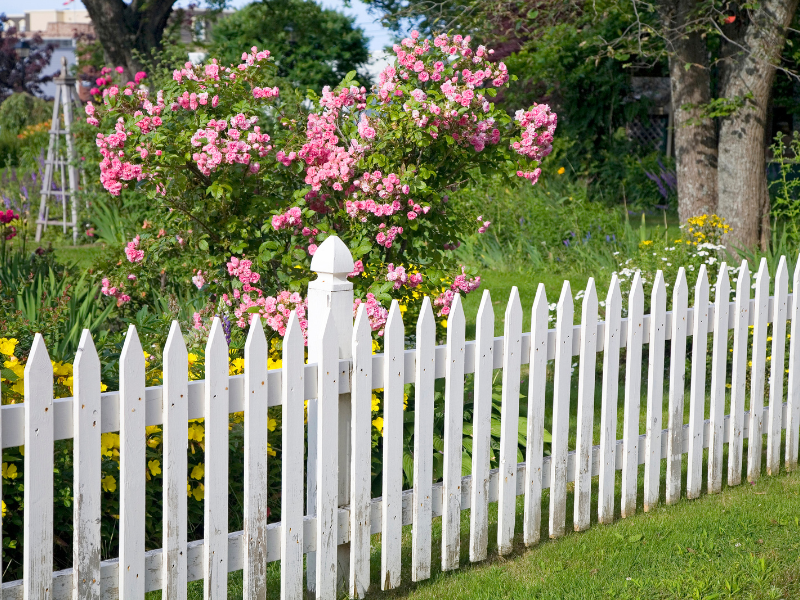 An image showing various decorative garden fencing options for landscape enhancement.