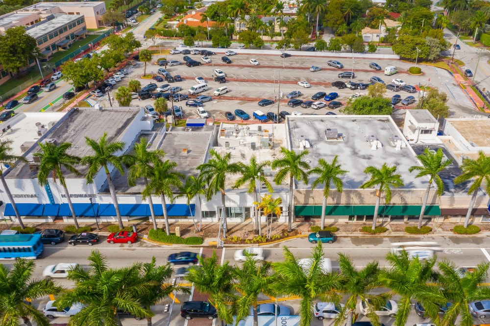 Aerial drone photoshoot of commercial area covered with license plate LPR cameras for license plate data capturing. Security camera coverage is vital for scanning license plate characters into the LPR system.
