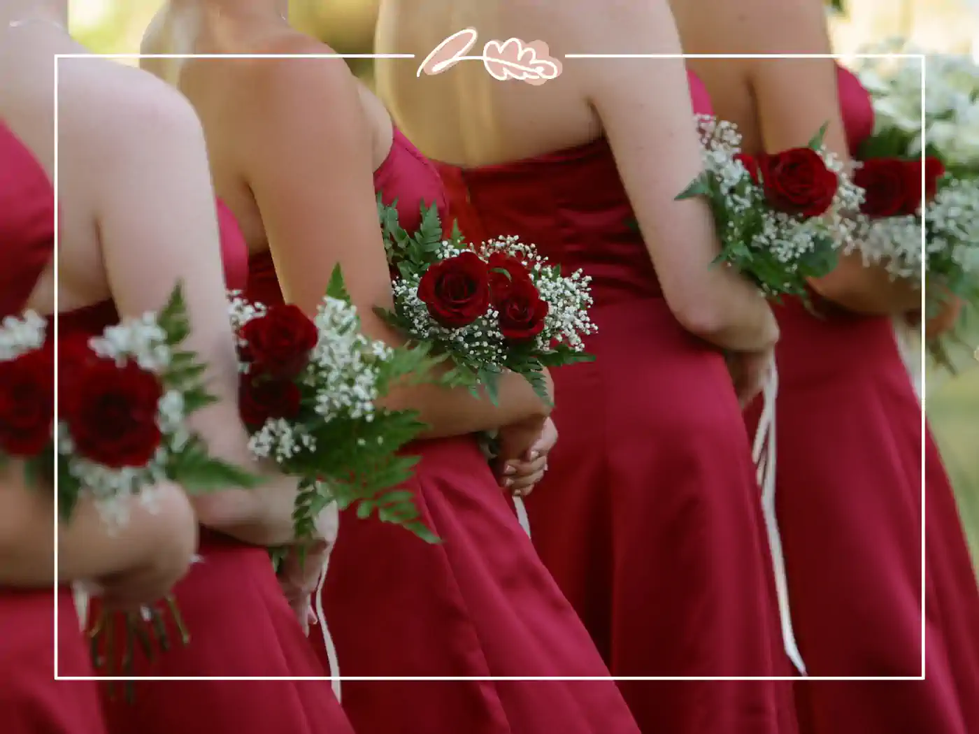 Bridesmaids holding red rose bouquets at a wedding. "Bridal Elegance" Fabulous Flowers and Gifts