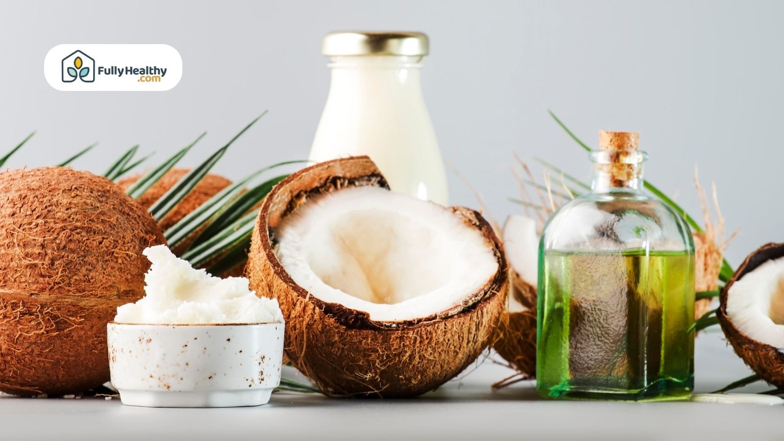 Fresh coconuts with coconut butter, oil, and milk displayed