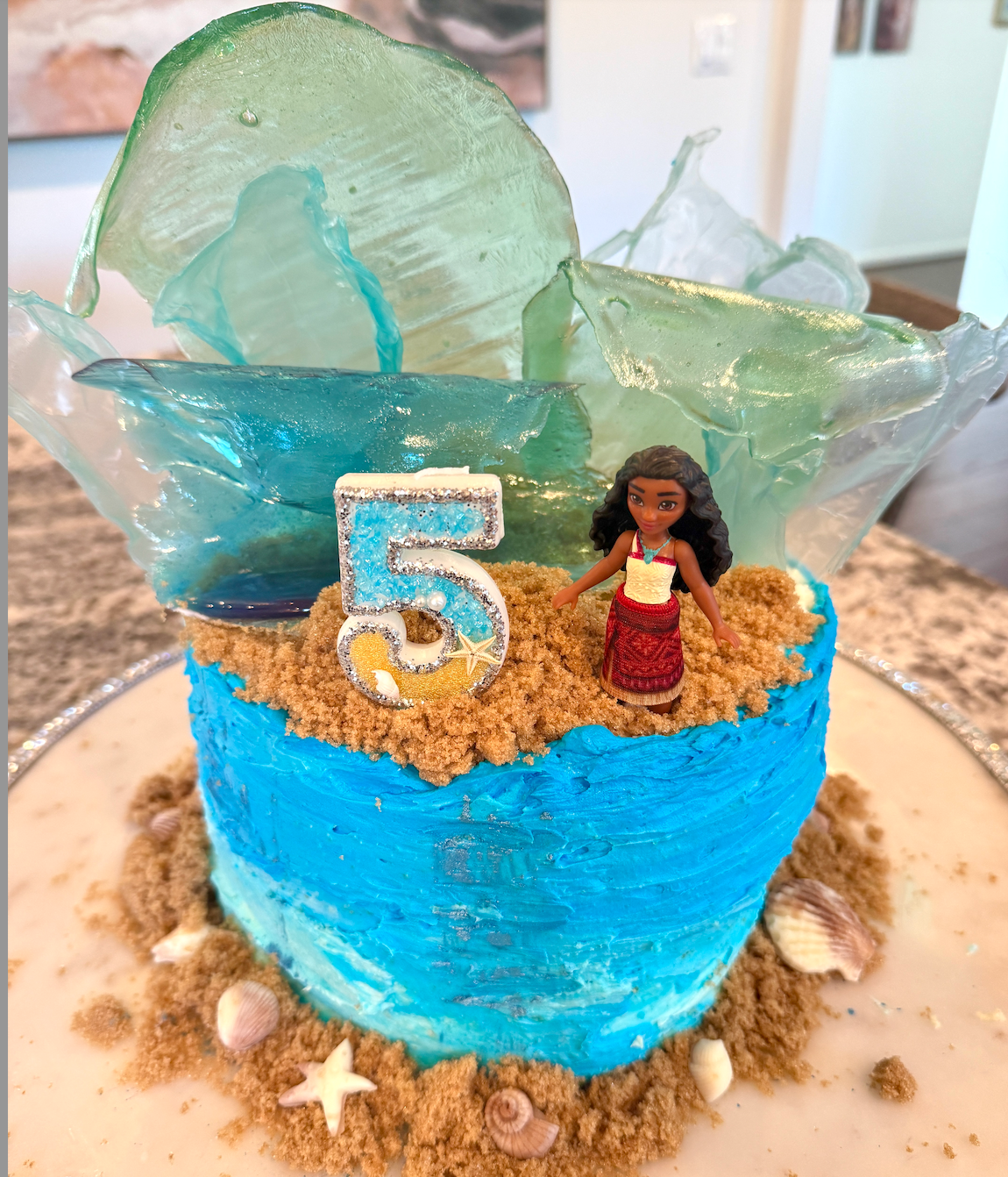 Capturing the exciting movie moments with the Moana cake I made- see how the waves vary in size and shape