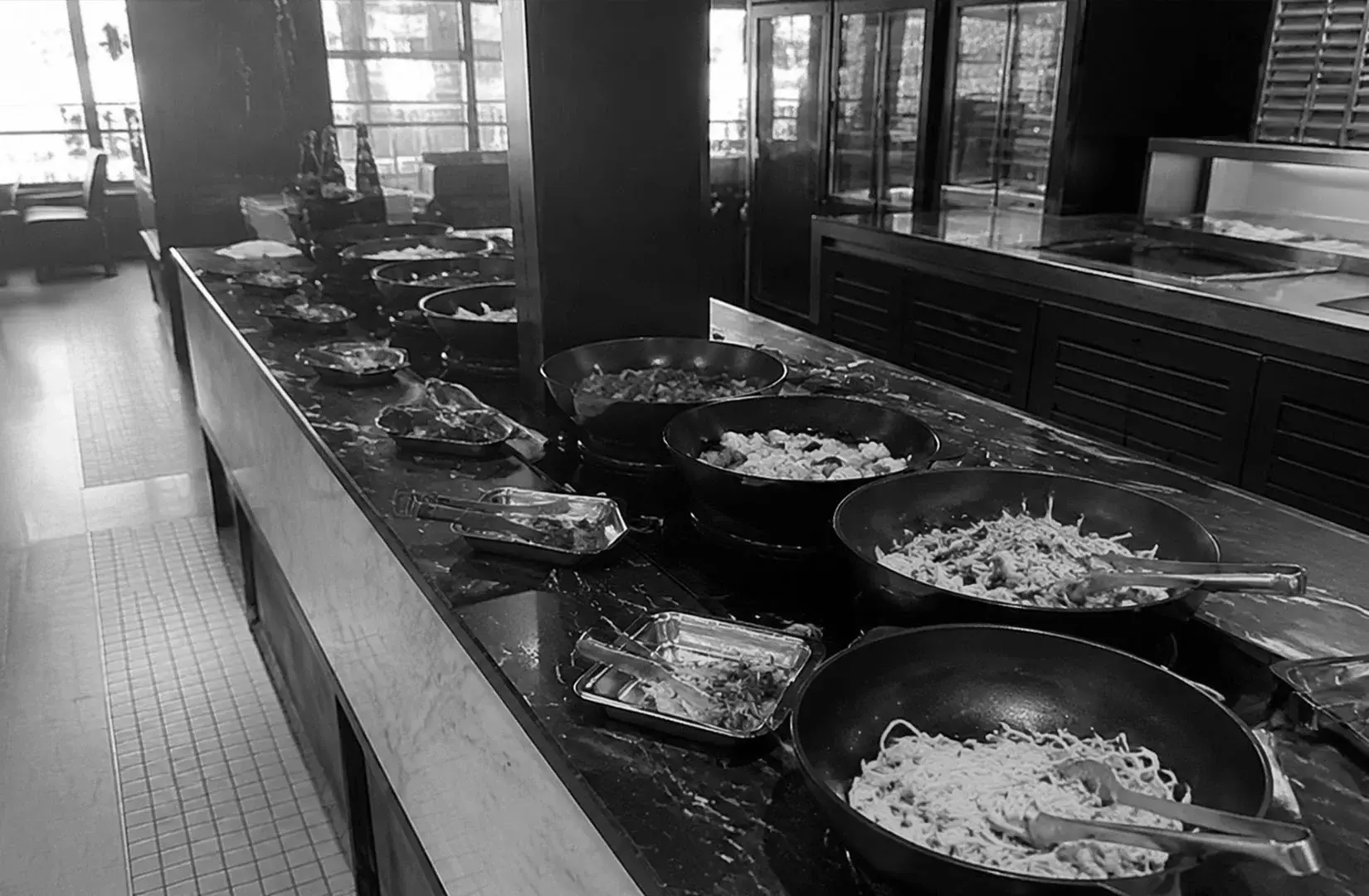 Beach Road Kitchen Singapore buffet station with plates and food displays