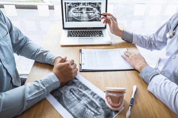 dental patient learning about recovery for orthognathic surgery during consultation