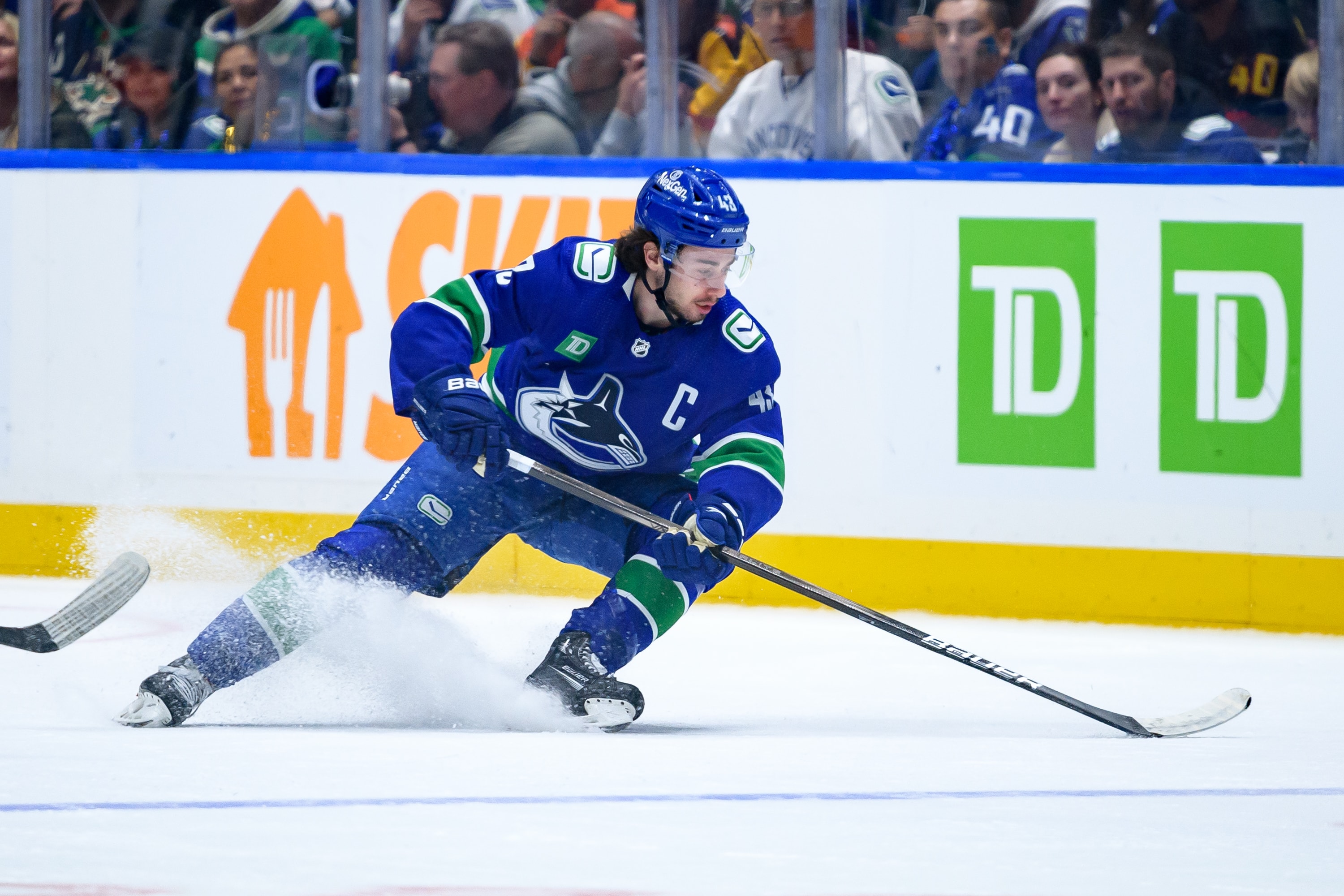 Quinn Hughes of the Vancouver Canucks skates with the puck during Game Five of the First Round of the 2024 Stanley Cup Playoffs at Rogers Arena on April 30, 2024 in Vancouver, British Columbia, Canada.