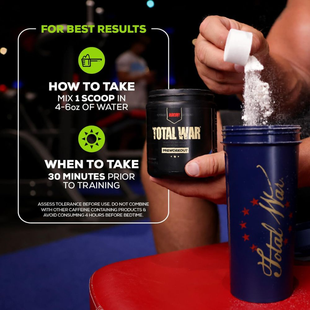 A person measuring out a scoop of Total War Pre Workout powder