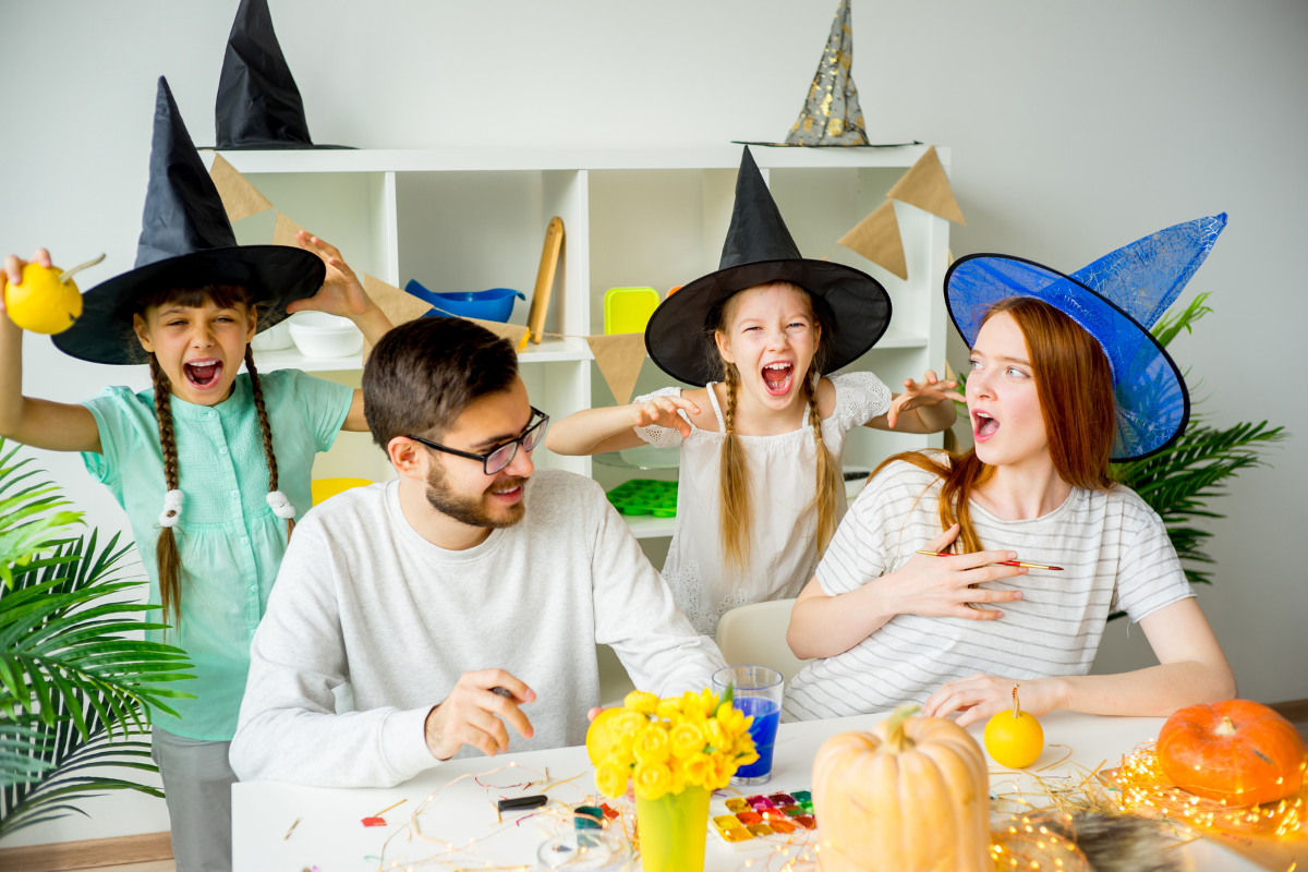 A family in Disney-inspired Halloween costumes, showcasing characters like Ariel and Peter Pan.