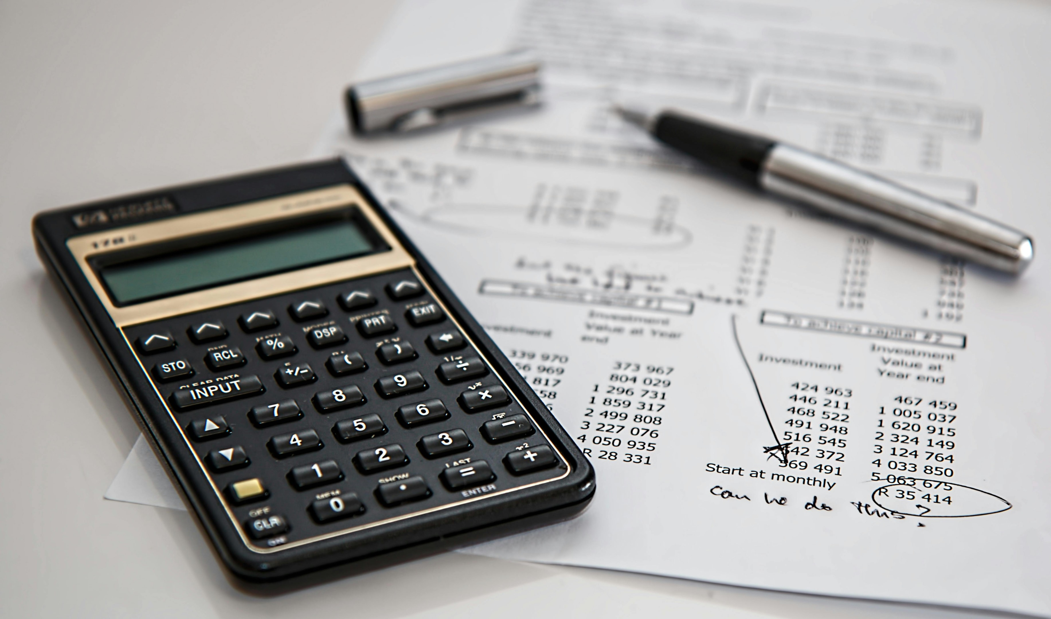 Budget being mapped out on paper by real estate investor to plan future investments.