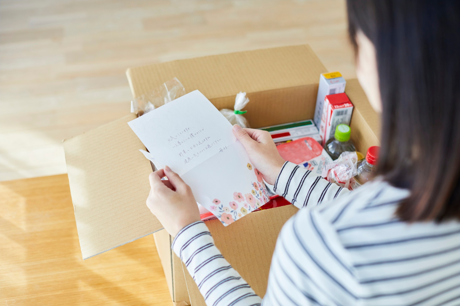 A family opening a care package.