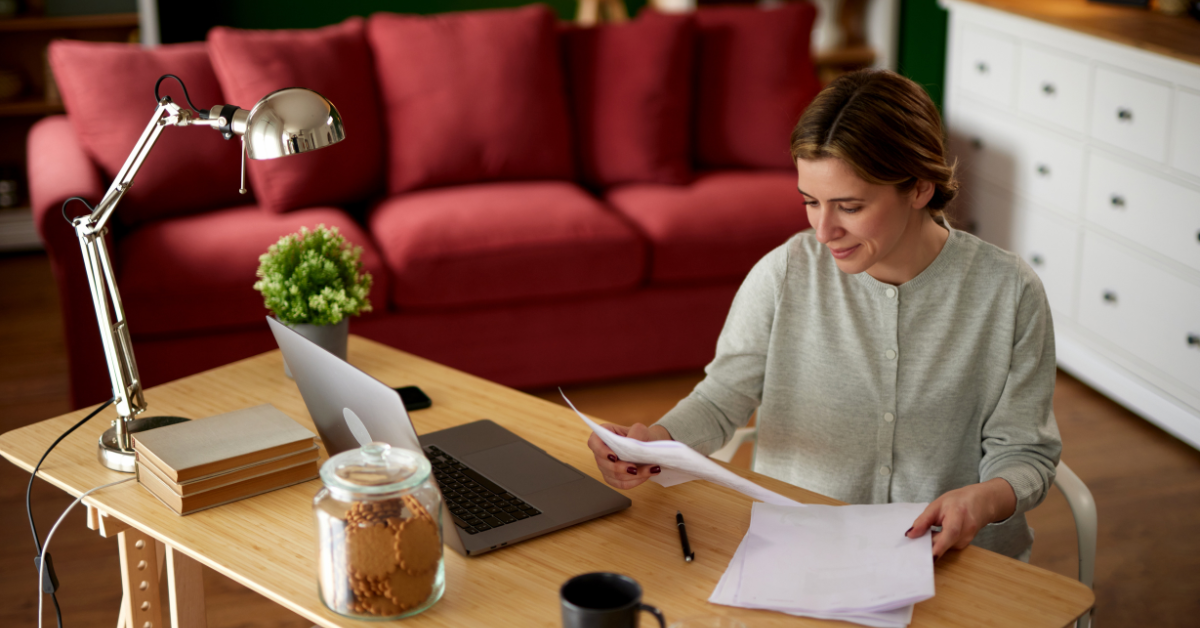 Woman checking her Fidelity tax information and account statements for tax filing preparation.