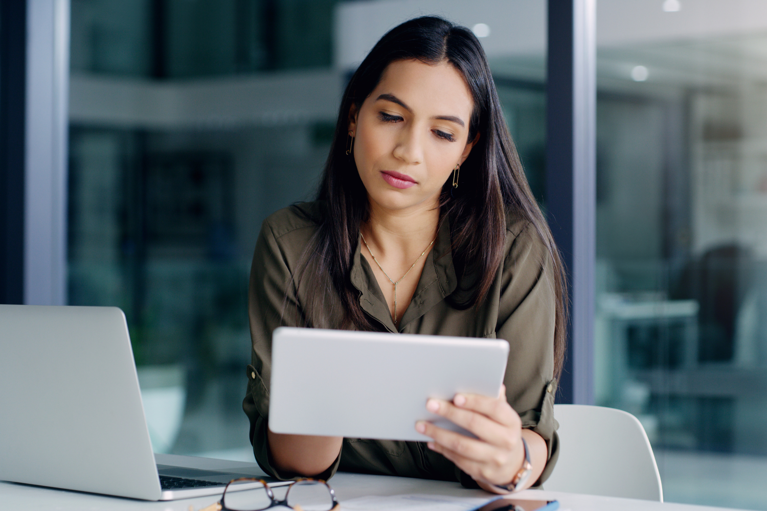 Manager checking something on her tab.