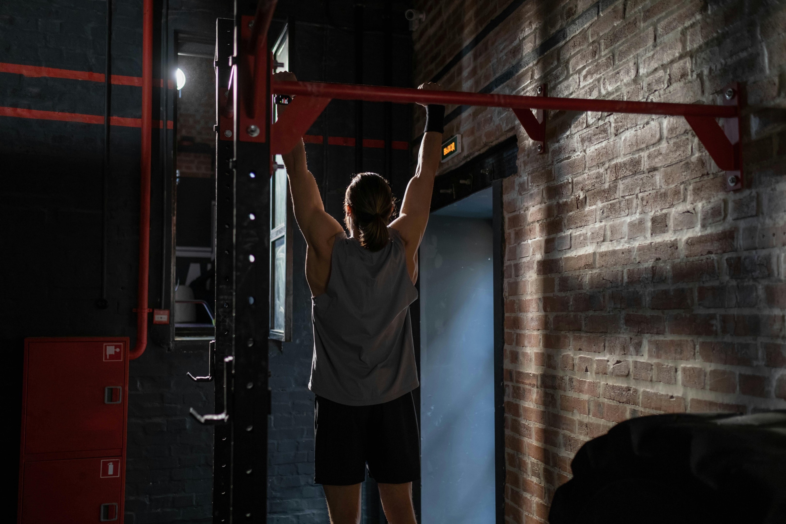 Photo by cottonbro studio: https://www.pexels.com/photo/man-doing-pull-ups-7672092/