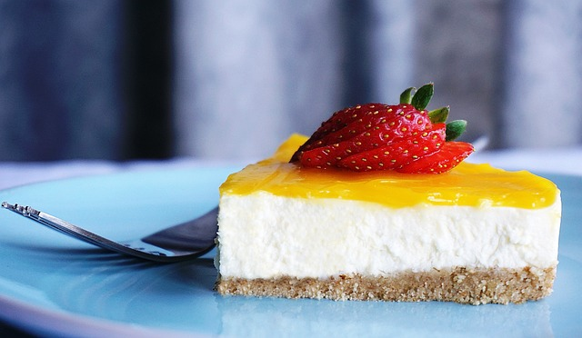 A lemon creamy cheesecake with caramel sauce and a graham cracker crust base. 