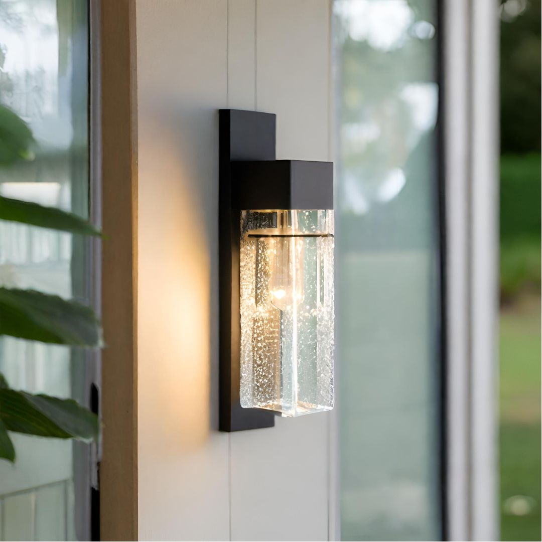 A wall sconce with bubbled crystal placed on an outdoor.