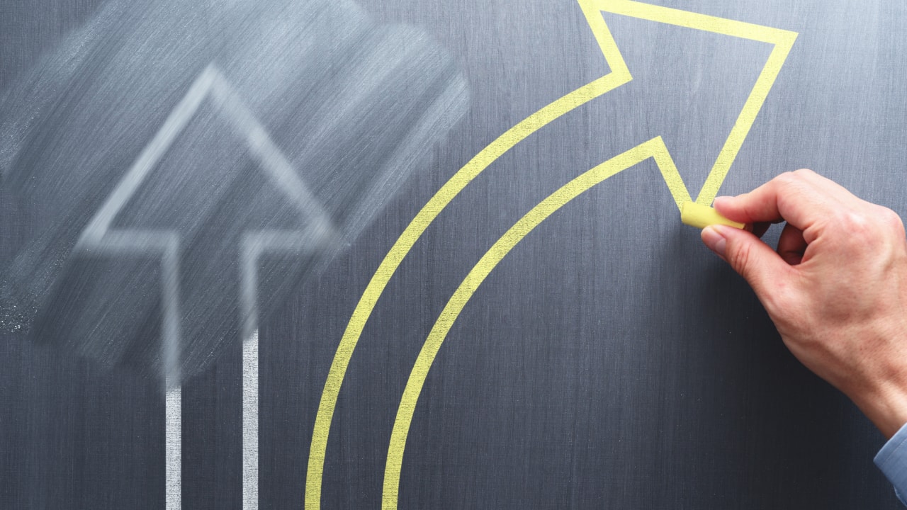 arrows on chalkboard representing business changes