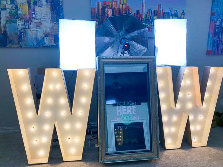 We've been making giant photo props for party photos for years! Graduation photo booth props like these marquee lighted W letters bring a fun energy to the party.