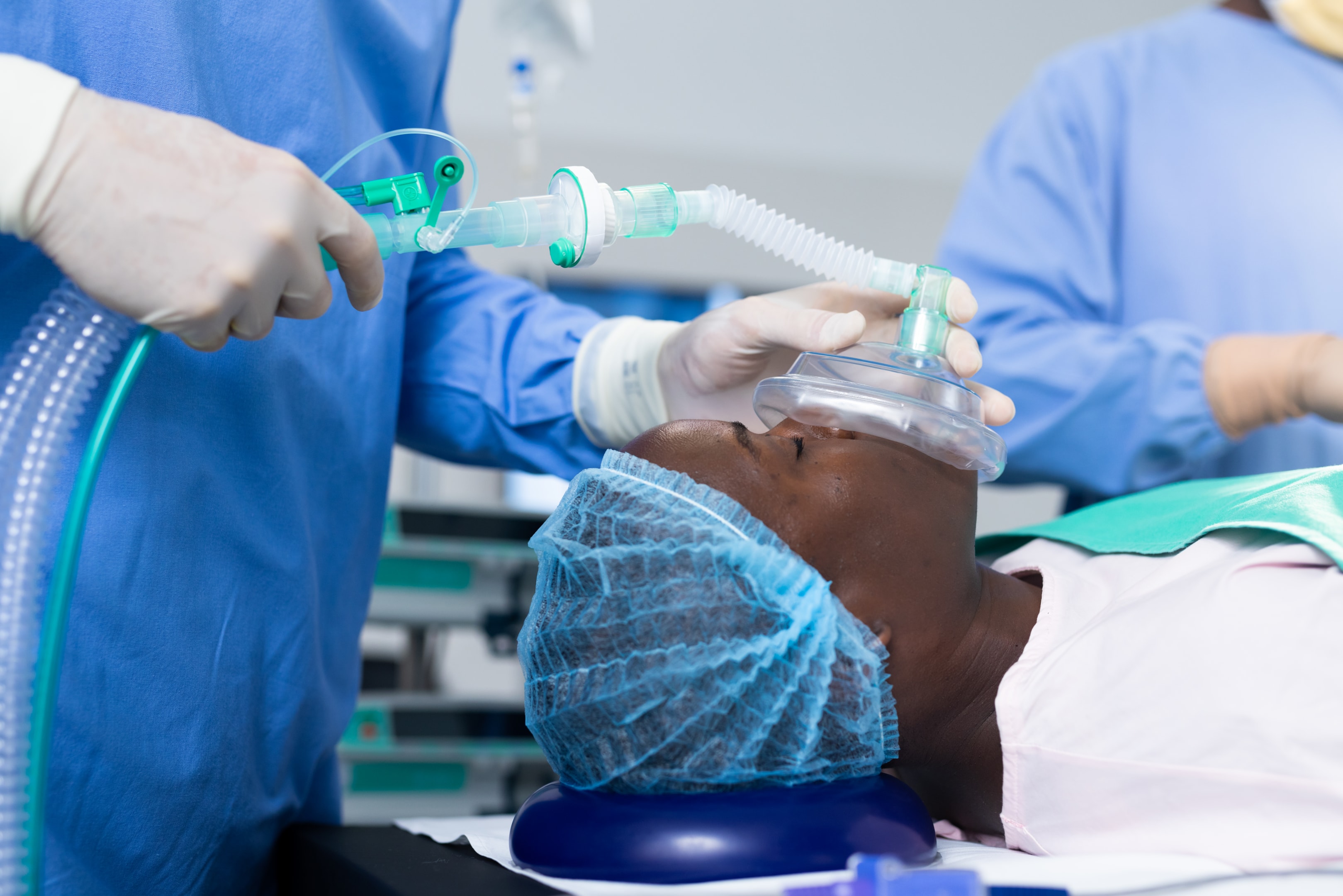 Doctor giving anesthesia to patient before wisdom tooth surgery