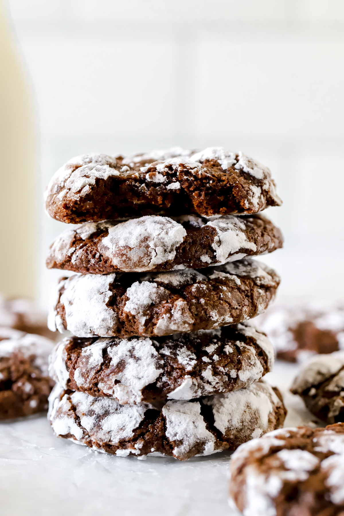 double chocolate crinkle cookies stacked on top of each other