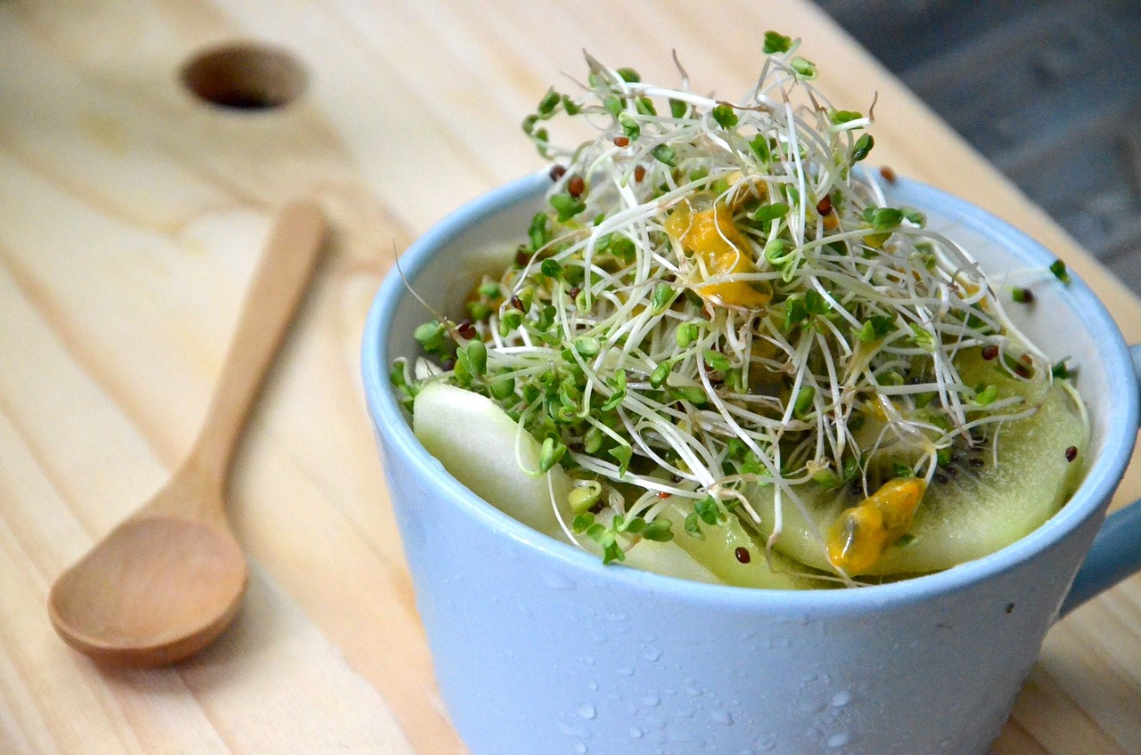 Fruit salad topped with broccoli sprouts. (c) Jack Yoong, Pixabay.