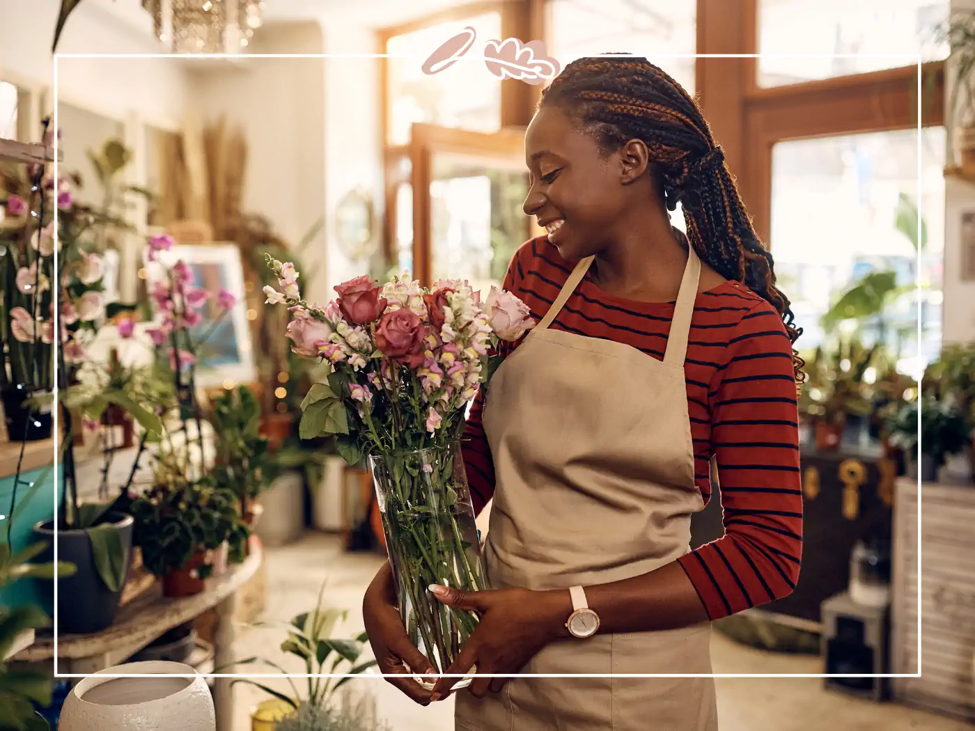 Woman smiling while holding a vase of flowers in a shop - fabulous flowers and gifts