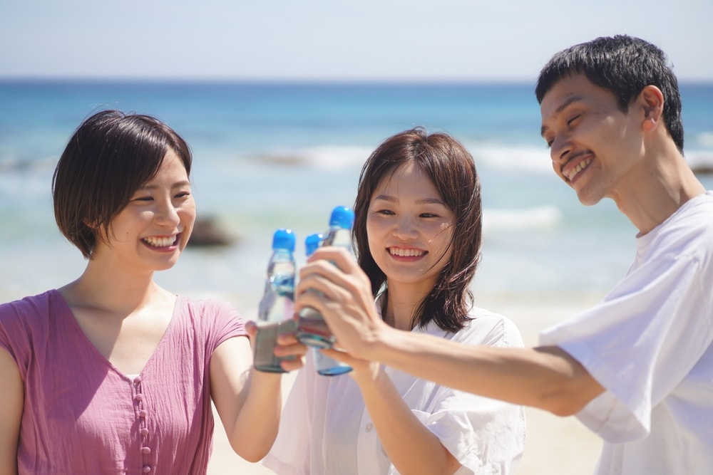 Men and women drinking ramune