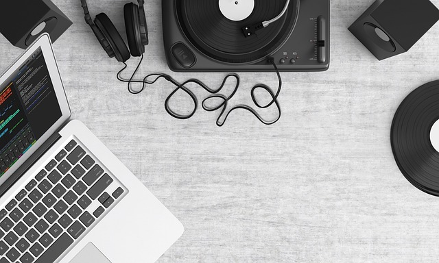 A person checking the quality of a vinyl record