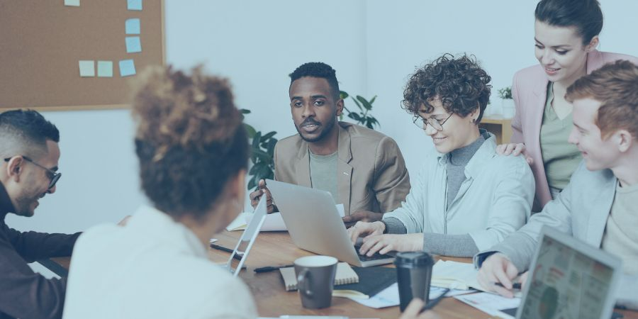 People sitting in an office engaging with each other 