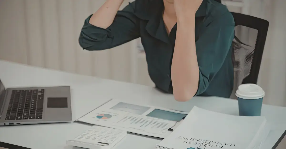 Female content creator calculating her earnings to understand what is take-home income.