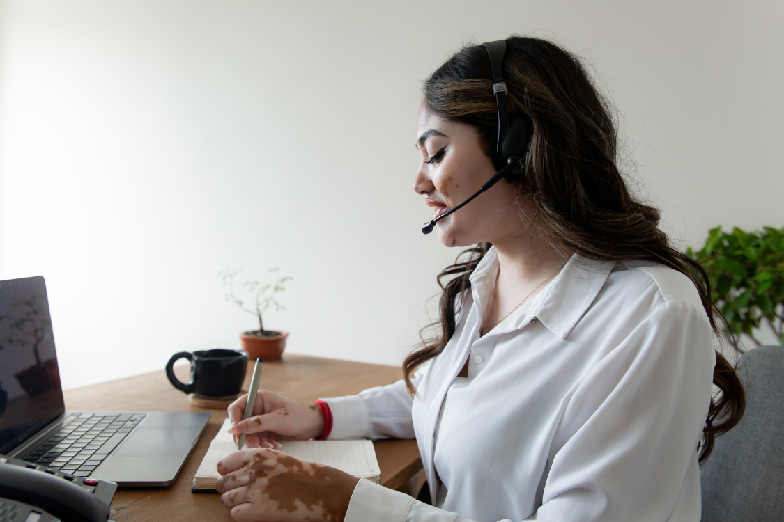 Female customer service representative working remotely with headset
