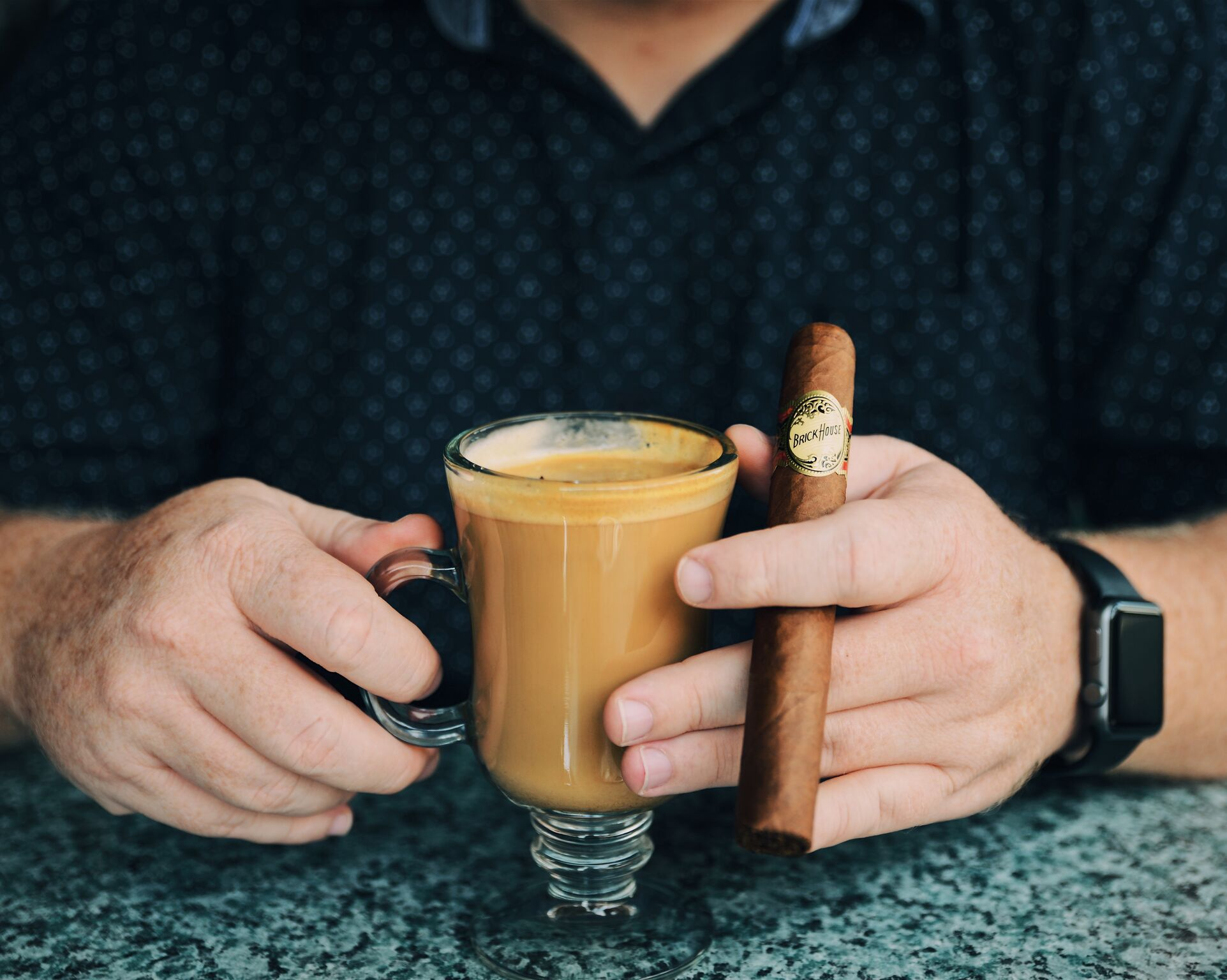 Artistic representation of a men enjoying a Brick House Premium Cigars and a Cup of Coffee
