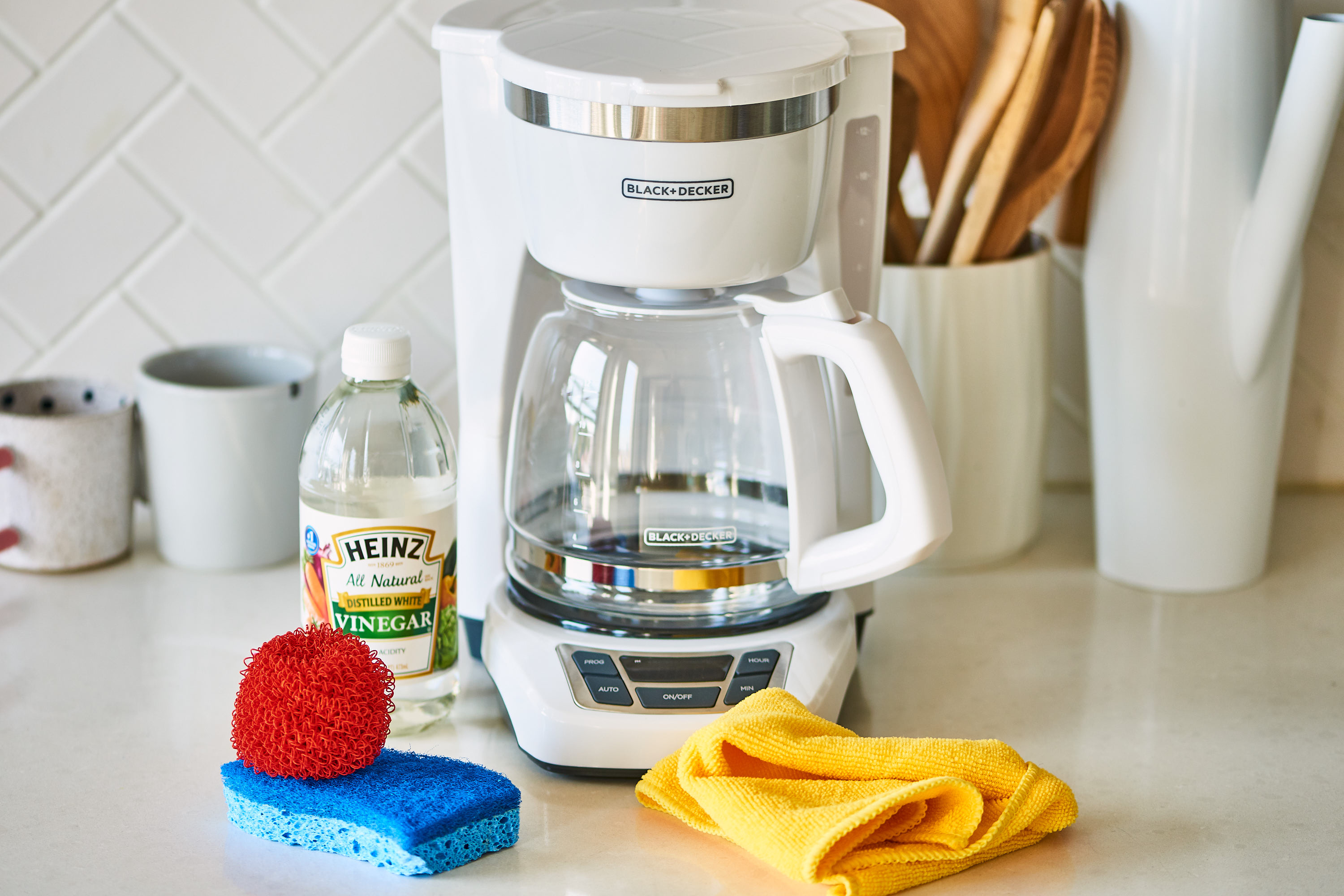 Wash the exterior of the coffee maker with soapy water