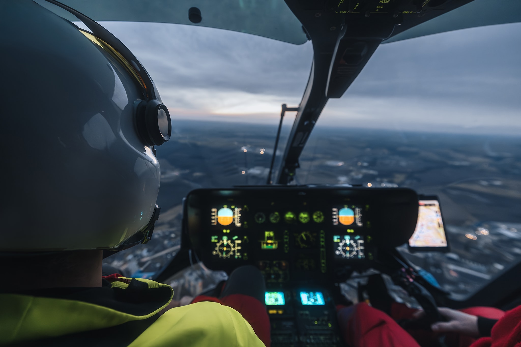 A helicopter flying at high altitude, demonstrating training benefits.