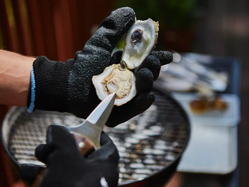 Image featuring White Stone Oyster's superior shucking gloves.