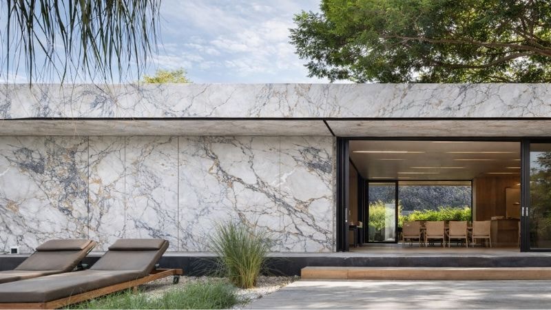 Front elevation of a home installed with marble vinyl wrap