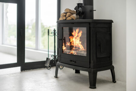 A wood stove burning wood with heat values in a controlled environment 