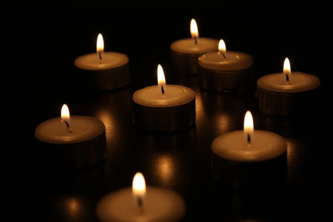 This image displays candles with cotton wicks.