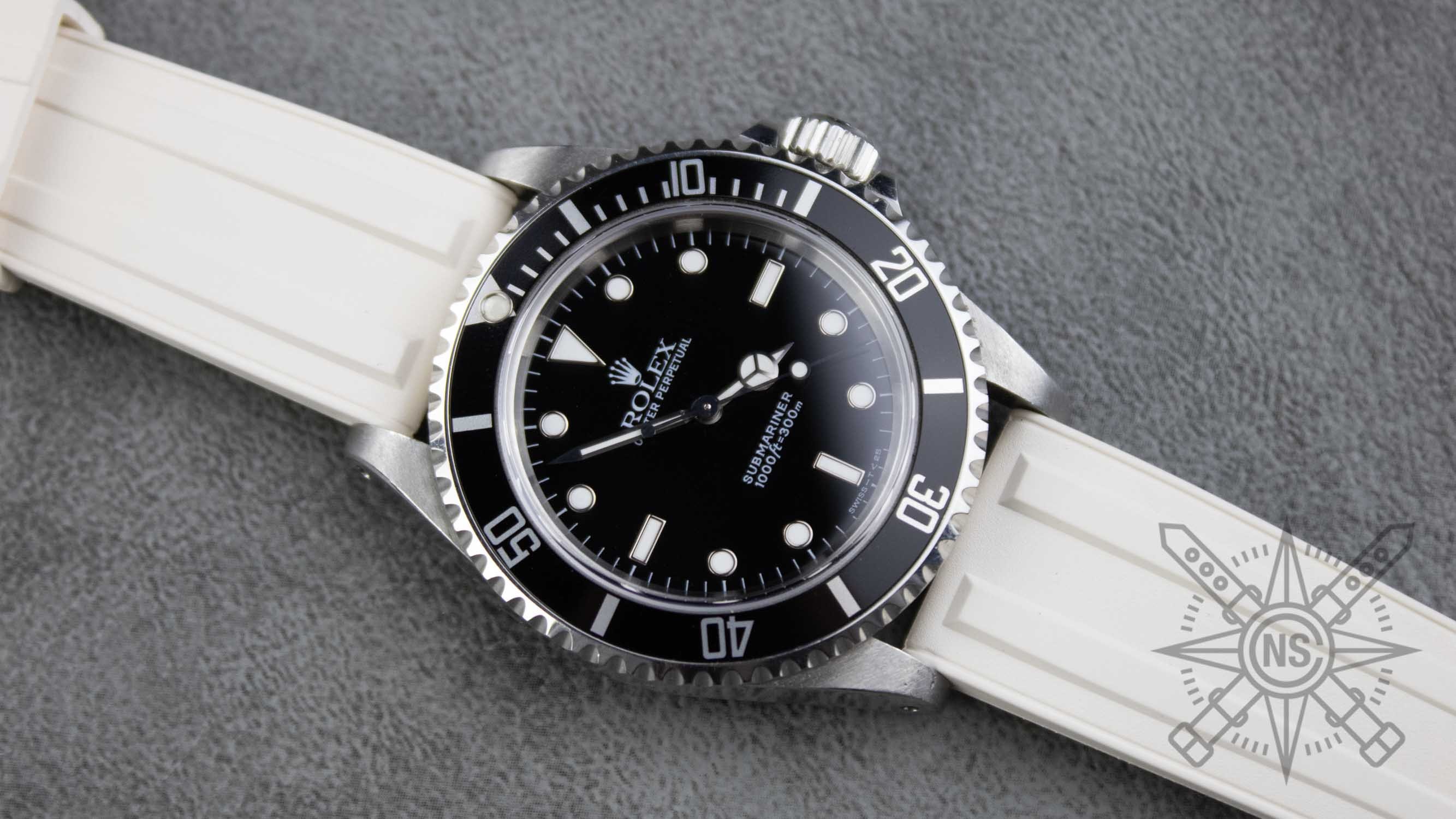 A stylish timepiece with a white rubber strap, showcasing its elegant design.