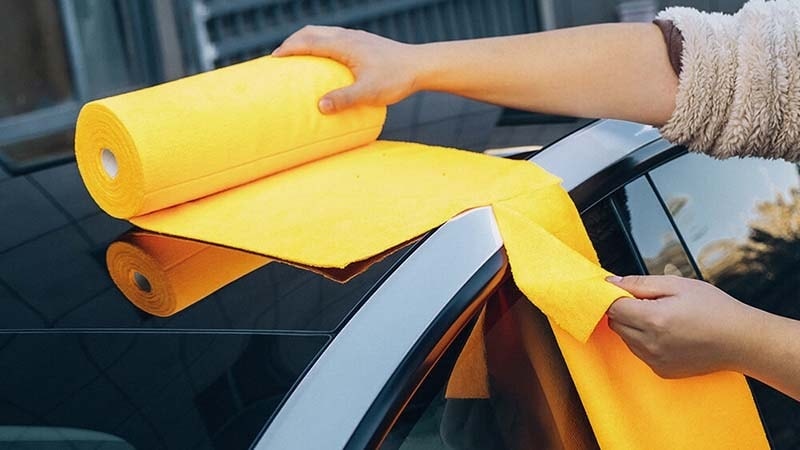 Yellow roll of tear-away microfiber towels