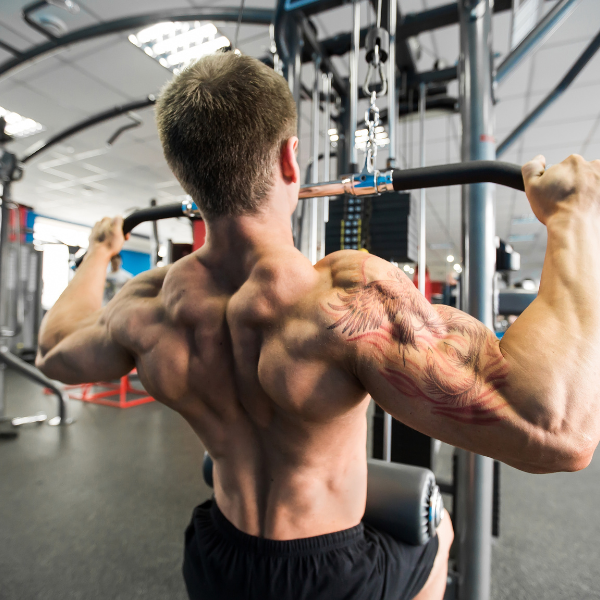 A photograph showing proper form for wide-grip lat pulldown.