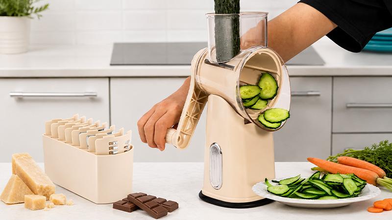 Cheese grater sharpness test with hard cheese, chocolate, and vegetables.