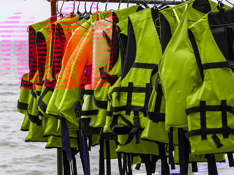 Life jackets neatly stored and easily accessible on a boat.